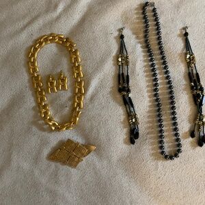 Two lovely, exotic necklace and earring pairings.